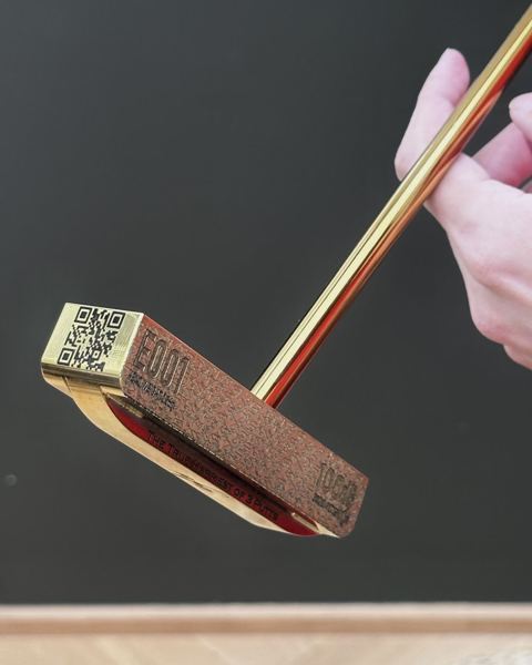 Toe of the head with a QR code, E001 and head weight engraved